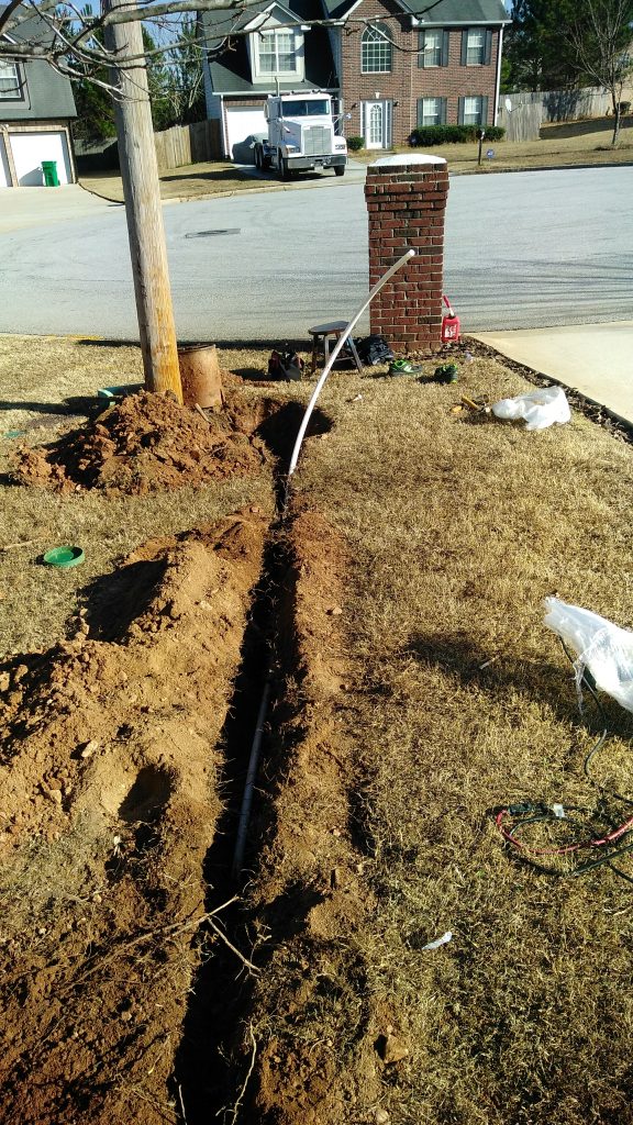 Trench open, new pipe going in — done right the first time.